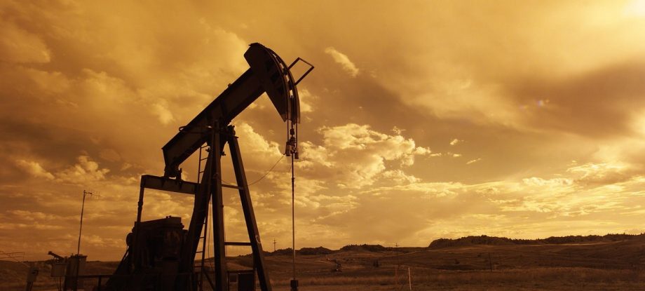 Photograph of an oil field at sunset shale.